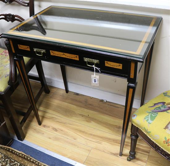An ebonised and sycamore Godwin style side table W.76cm